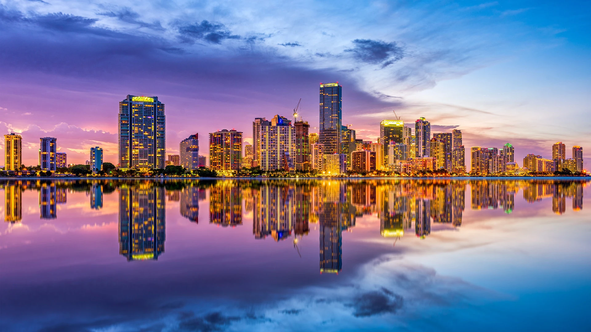 Miami skyline representing the comparison between two Florida 100% commission brokerages